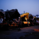 Farmers sleeping in their modified tractor trolleys.